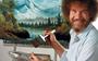 Bob Ross cultheld die landschappen met gemak op het witte doek toverde.