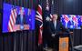 De Australische premier Scott Morrison kondigt het AUKUS-bondgenootschap aan, geflankeerd door de Britse premier Boris Johnson (l) en de Amerikaanse president Joe Biden op beeldschermen. 